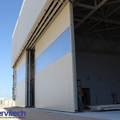 portone-industriale-scorrevole-bologna-parma|porte-scorrevoli-per-capannoni-bologna|portone-scorrevole-per-capannoni-agricoli-bologna|portone-scorrevole-per-hangar-parma|prezzi-porte-scorrevoli-per-stalle-e-capannoni-agricoli-parma|ridotti-interventi-di-manutenzione|battenti-singoli-o-sovrapposti